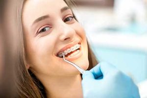 woman being operated on, dental braces tx