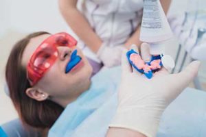 woman being operated on by dentists, fluoride treatments tx