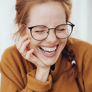 woman smiling after general dentistry