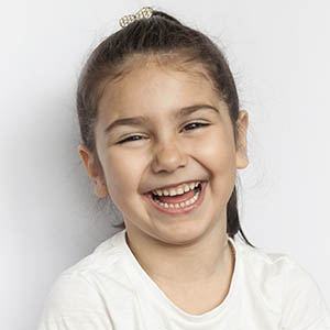 child smiling after pediatric dentistry