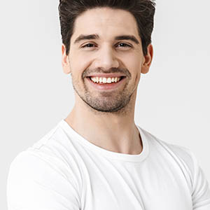 man smiling after teeth whitening