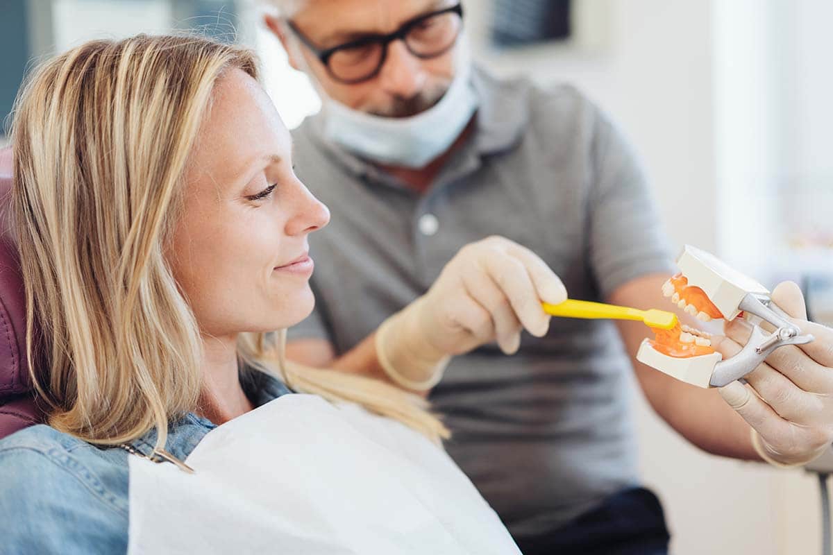 importance of dental hygiene female patient learning the importance of dental hygiene