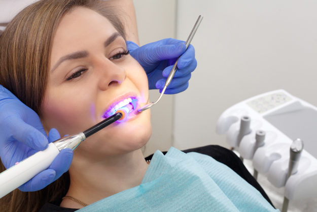patient having dentist Treating a Chipped Tooth