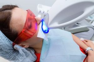 woman gets teeth whitening services