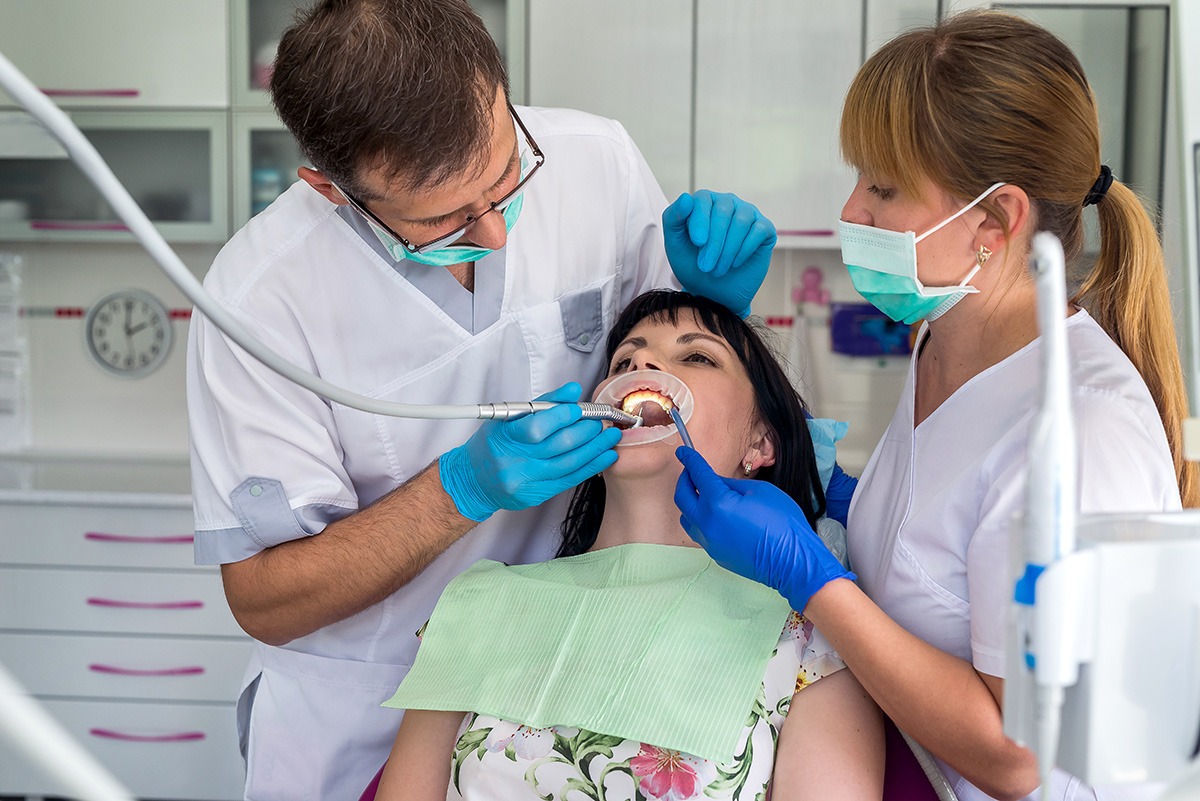 4 Common Types of Oral Surgeries (3) dentists performing oral surgeries